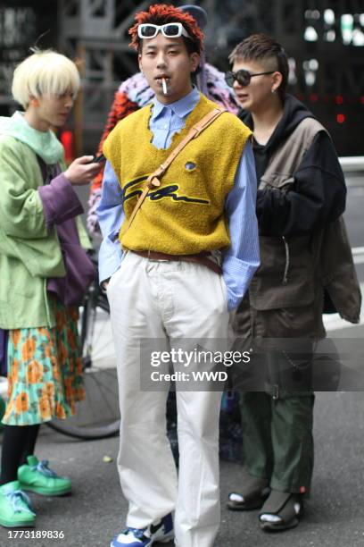 An atendee of Tokyo Fashion Week AW 2018 stops for a street style photograph.