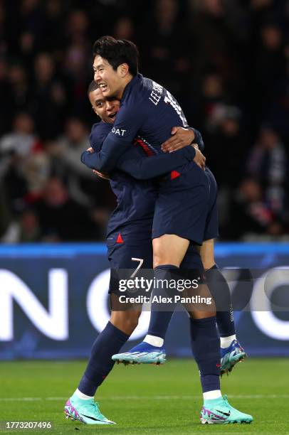 Lee Kang-In of PSG celebrates with team mate Kylian Mbappe after he scores his sides first goal during the Ligue 1 Uber Eats match between Paris...