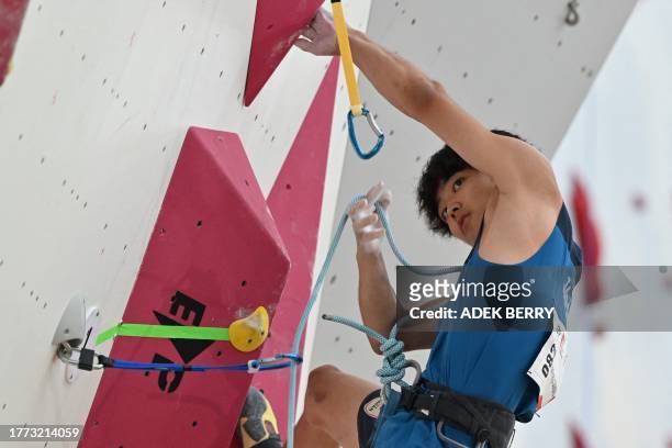 Japan's Sorato Anraku competes in the men's lead discipline during the sport climbing Asian qualifier for the 2024 Paris olympics in Jakarta on...
