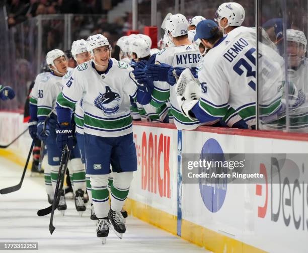 Ilya Mikheyev of the Vancouver Canucks celebrates his first period goal against against the Ottawa Senators with teammates at the players' bench at...