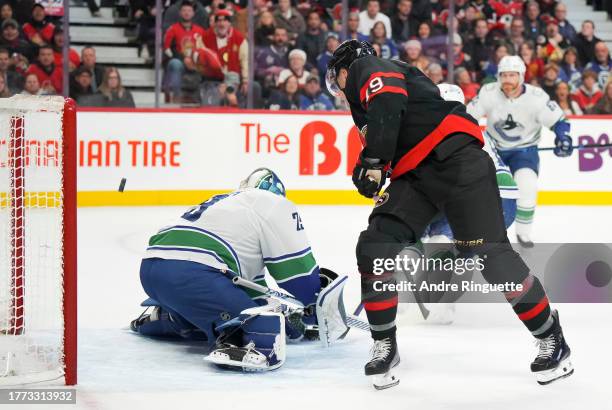 Drake Batherson of the Ottawa Senators scores a first period goal against Casey DeSmith of the Vancouver Canucks at Canadian Tire Centre on November...