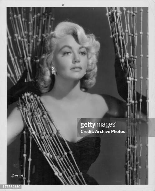 Promotional shot of actress Dorothy Malone, as she appears in the movie 'Quantez', 1956.
