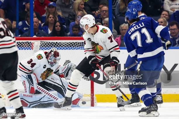 Anthony Cirelli of the Tampa Bay Lightning scores past Petr Mrazek of the Chicago Blackhawks during the first period at the Amalie Arena on November...