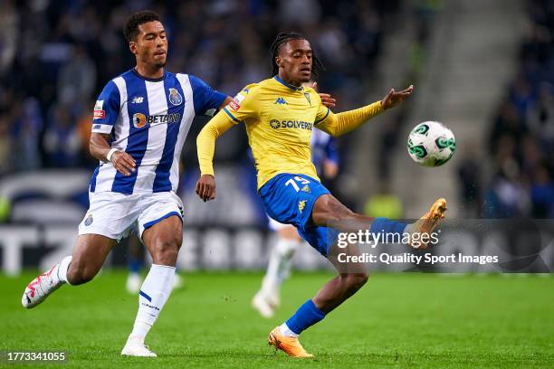 Danny Namaso Edi-Mesumbe Loader of FC Porto competes for the ball with Wagner Fabricio Cardoso de Pina of GD Estoril Praia during the Liga Portugal...