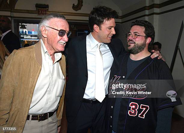 Executive Producer Stan Lee with cast members Ben Affleck and Kevin Smith pose in the lobby at the premiere of "Daredevil" at the Village Theatre on...