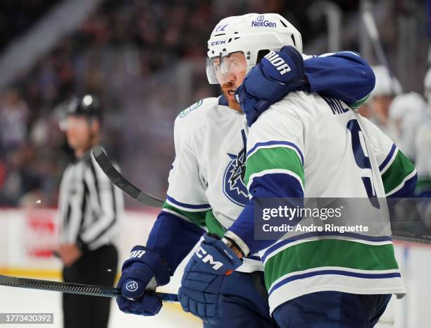 Miller of the Vancouver Canucks celebrates his second period goal against the Ottawa Senators with teammate Ian Cole at Canadian Tire Centre on...