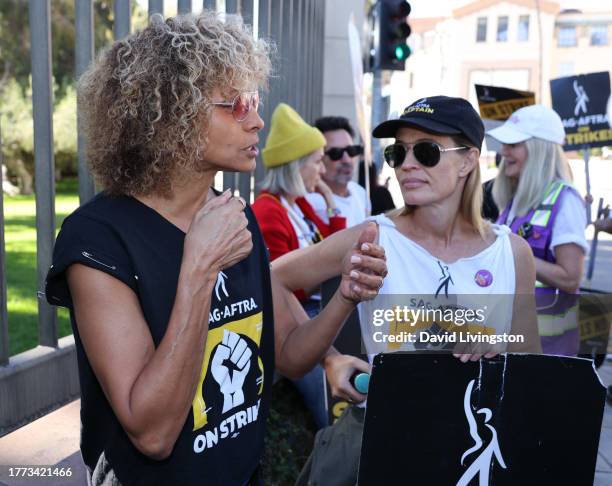 Michelle Hurd and Jeri Ryan join the picket line outside Warner Bros. Studios on November 03, 2023 in Burbank California. SAG-AFTRA has been on...