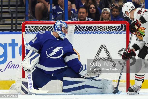 Corey Perry of the Chicago Blackhawks tips a goal past Jonas Johansson of the Tampa Bay Lightning during the second period at the Amalie Arena on...