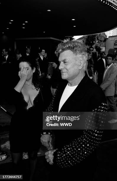 Lisa Deutsch and Tony Curtis attend the premiere of "True Lies" in Westwood, California, on July 15, 1994.