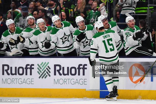 Craig Smith of the Dallas Stars high-fives his teammates after scoring a goal during the second period of a game against the Columbus Blue Jackets at...