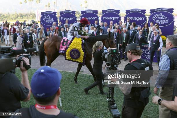 Lanfranco Dettori aboard Unquestionable of France enters the winners circle after winning the Prevagen Breeders' Cup Juvenile Turf at Santa Anita...