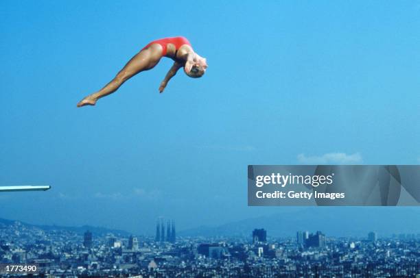 Tracey Miles of Great Britain is captured high over the Sagrada Familia during a diving competition prior to the Barcelona Olympics of 1992.