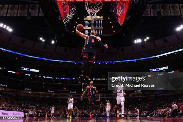 Zach LaVine of the Chicago Bulls dunks against the Brooklyn Nets in the first half of the NBA In-Season Tournament at the United Center on November...