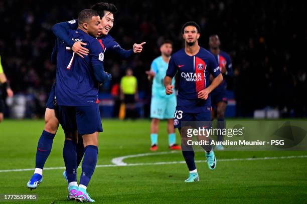 Lee Kang In of Paris Saint-Germain is congratulated by teammate Kylian Mbappe after scoring during the Ligue 1 Uber Eats match between Paris...
