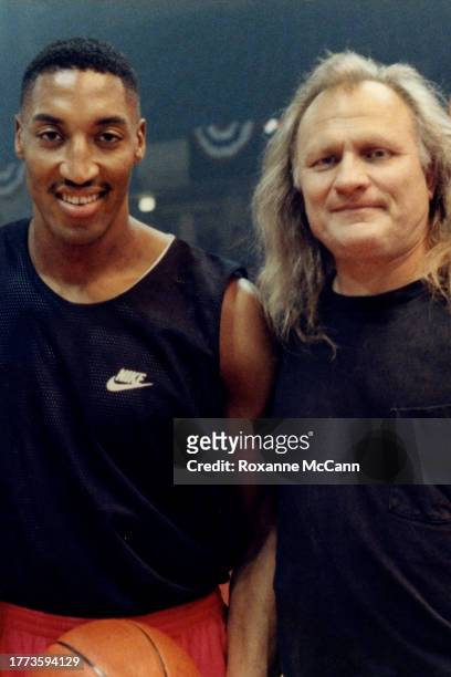 Scottie Pippen of the Chicago Bulls, wearing a black Nike tank top and red shorts and Joe Pytka stop for a photo on the set of a Nike commercial in...
