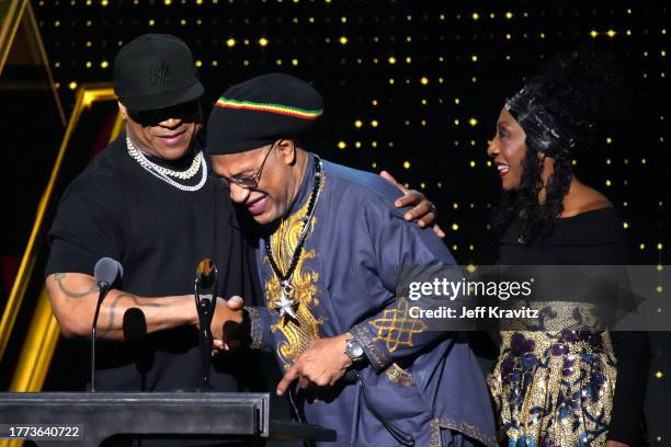 Cool J and Cindy Campbell present an award to DJ Kool Herc onstage during the 38th Annual Rock & Roll Hall Of Fame Induction Ceremony at Barclays...