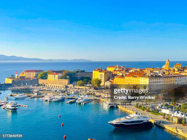 golden early morning sunlight on modern buildings near the harbor in ajaccio - ajaccio stock pictures, royalty-free photos & images