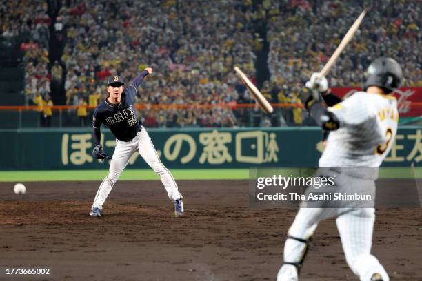 Daiki Tajima of the Orix Buffaloes breaks the bat of Yusuke Oyama of the Hanshin Tigers in the 4th inning during the Japan Series Game Five at...