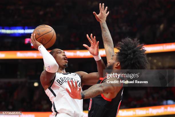 Lonnie Walker IV of the Brooklyn Nets shoots over Coby White of the Chicago Bulls in the second half of the NBA In-Season Tournament at the United...