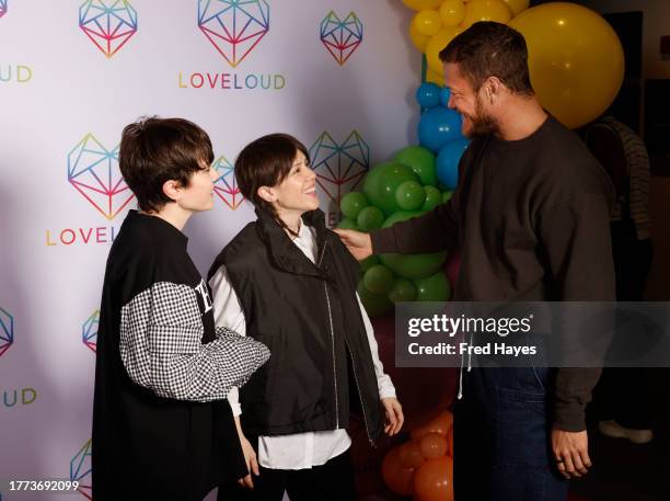 Sara Quin and Tegan Quin of Tegan and Sara talk to Dan Reynolds at the LOVELOUD Red Carpet at the Delta Center on November 03, 2023 in Salt Lake...