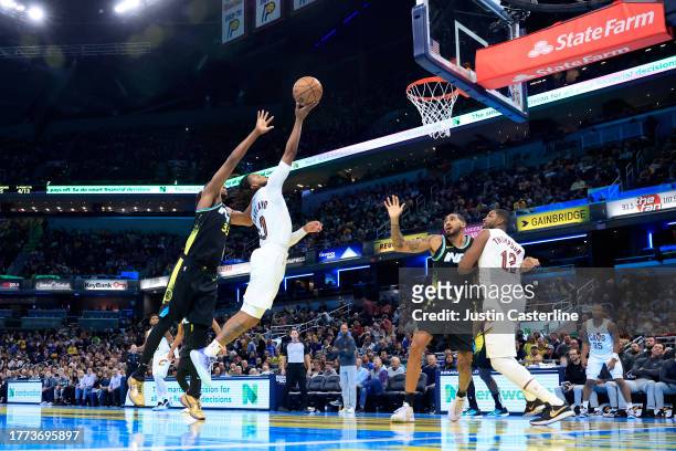 Darius Garland of the Cleveland Cavaliers takes a shot while defended by Myles Turner of the Indiana Pacers during the first half during the NBA...