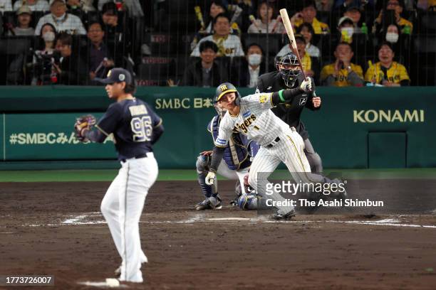 Shota Morishita of the Hanshin Tigers hits a two run triple in the 8th inning against Orix Buffaloes during the Japan Series Game Five at Hanshin...