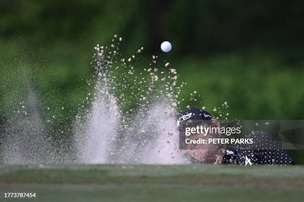 Patrick Reed of the US hits a shot out of the bunker on day two of the Hong Kong Open at Fanling golf club in Hong Kong on November 10, 2023.