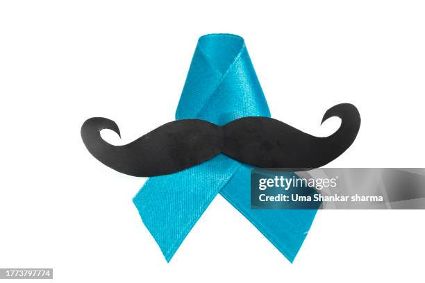 prostate cancer awareness ribbon with mustache isolated on white. - movember stock-fotos und bilder