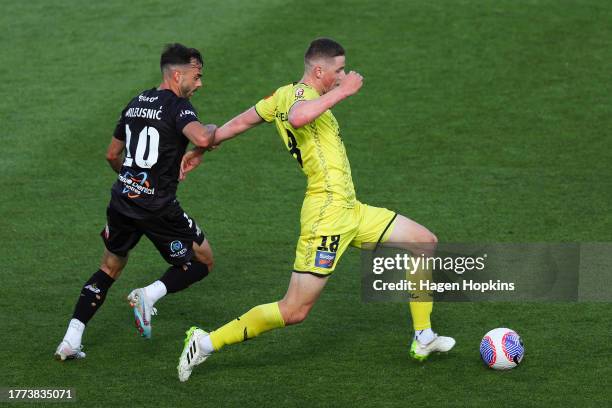 Lukas Kelly-Heald of the Phoenix is challenged by r10during the A-League Men round three match between Wellington Phoenix and Brisbane Roar at Sky...