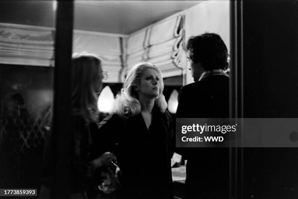 Catherine Deneuve awaits filming during production of "Hustle" in Los Angeles on Janry 22, 1975.