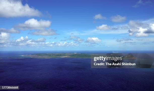 In this aerial image, earth and sand are sent into the air above a new islet off the coast of Iwoto island on November 3, 2023 in Ogasawara, Tokyo,...