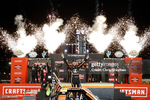 Ben Rhodes, driver of the Kubota Ford, celebrates in victory lane after winning the 2023 NASCAR Craftsman Truck Series Championship, finishing first...
