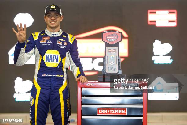 Christian Eckes, driver of the NAPA Auto Care Chevrolet, celebrates in victory lane after winning the NASCAR Craftsman Truck Series Craftsman 150 at...