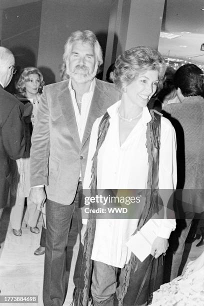 Kenny Rogers and Marianne Gordon attend a party at a Neiman-Marcus retail location in Los Angeles, California, on October 26, 1981.