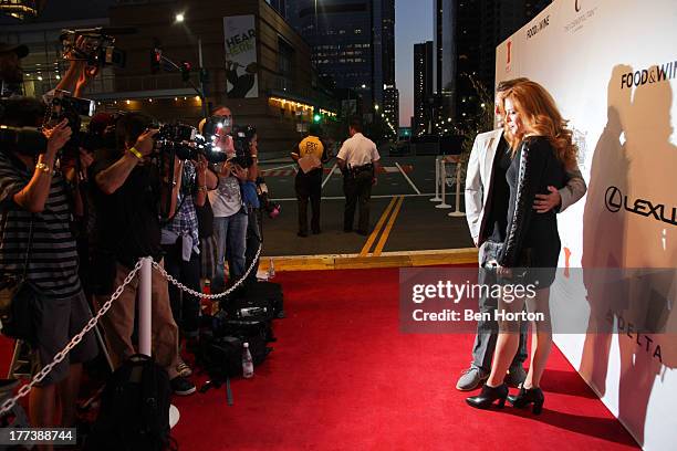 Rachelle Lefevre and guest attend the Festa Italiana with Giada de Laurentiis opening night celebration of the third annual Los Angeles Food & Wine...