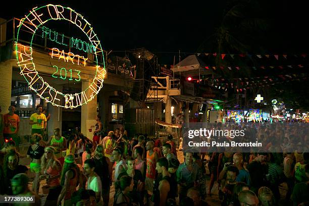 Thousands of people are attend the full moon party on the beach of Haad Rin on August 22, 2013 on Koh Phangan, Thailand. Thousands of people from...