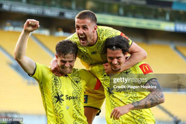 Oskar Zawada of the Phoenix celebrates with Alex Rufer and Scott Wootton after scoring a goal during the A-League Men round three match between...
