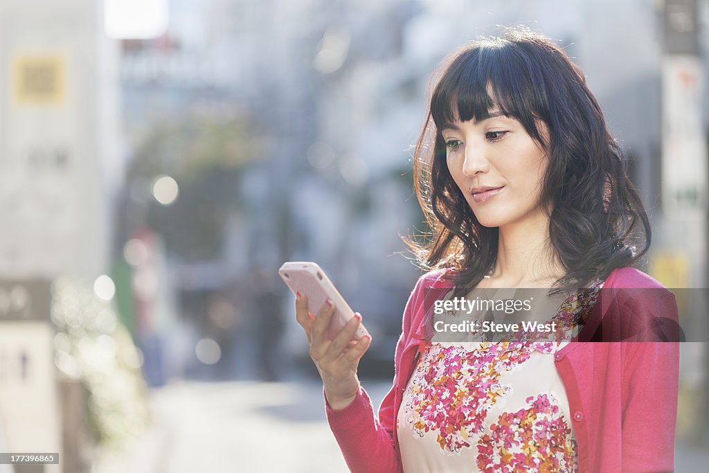 Woman Holding Mobile Phone