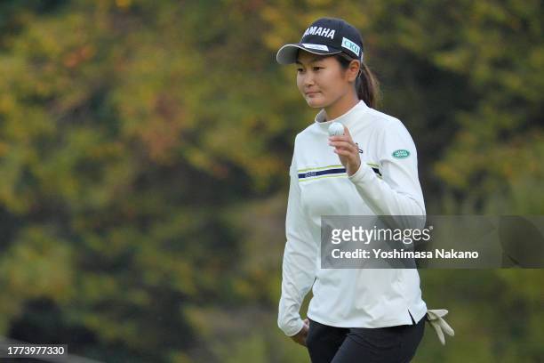 Sora Kamiya of Japan acknowledges the gallery after the birdie on the 17th green during the third round of the TOTO Japan Classic at the Taiheiyo...