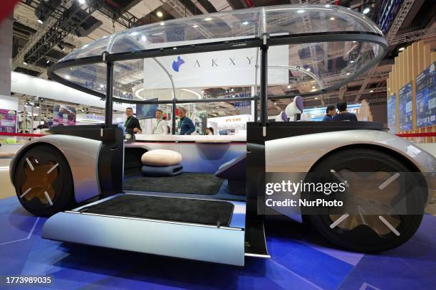 Visitors look at the AKXY2 concept car at Asahi Kasei's booth at the 6th CIIE in Shanghai, China, November 8, 2023.