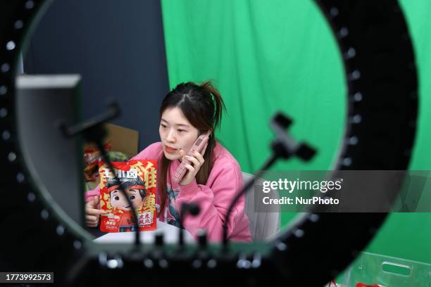 An anchor uses live streaming to sell goods in Binzhou, Shandong Province, China, Nov 9, 2023.