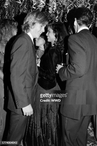 Christopher Atkins and Bianca Jagger attend a party, celebrating the 16th birthday of Calvin Klein's daughter, at Studio 54 in New York City on...