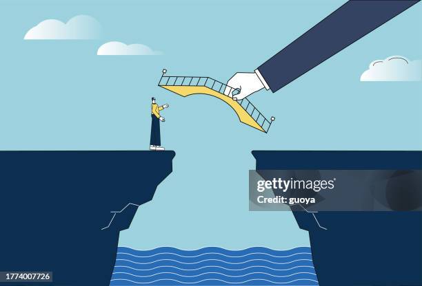 the giant helps the white-collar man build a bridge on the cliff. - bridge stock illustrations