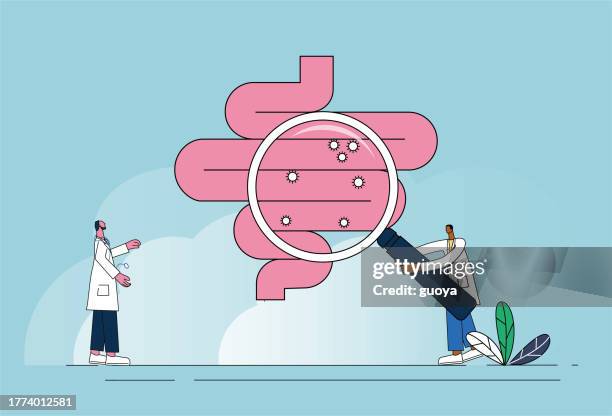 stockillustraties, clipart, cartoons en iconen met two doctors examined the intestines with a magnifying glass. - darmen