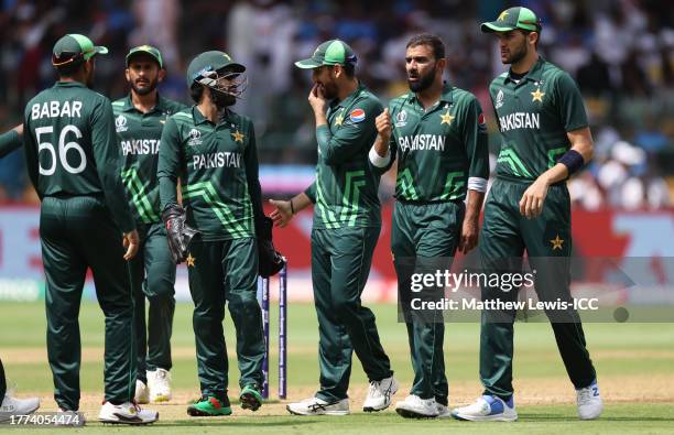 Players of Pakistan celebrates the wicket of Kane Williamson of New Zealand during the ICC Men's Cricket World Cup India 2023 between New Zealand and...