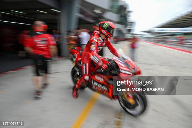 Ducati Lenovo Team's Italian rider Francesco Bagnaia leaves the pit lane during the practice session of the MotoGP Malaysian Grand Prix at the Sepang...