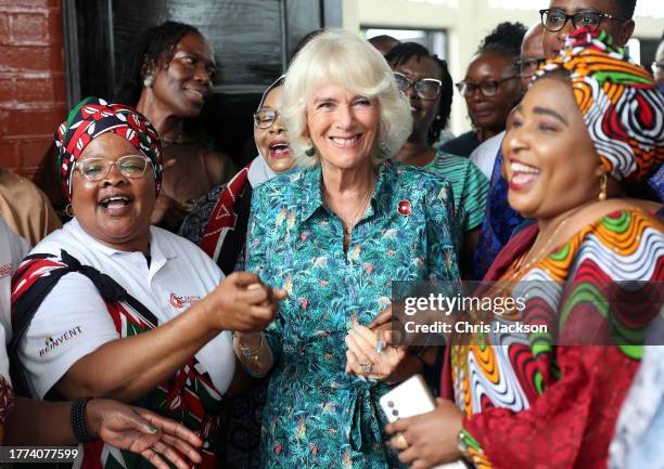 Queen Camilla dances with volunteers and staff from Sauti Ya Wanawake at the Situation Room on November 03, 2023 in Mombasa, Kenya. The Situation...