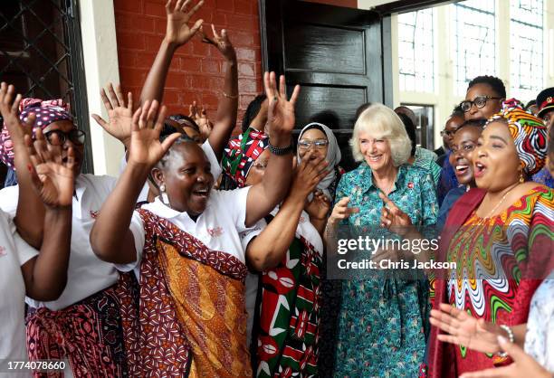 Queen Camilla dances with volunteers and staff from Sauti Ya Wanawake at the Situation Room on November 03, 2023 in Mombasa, Kenya. The Situation...