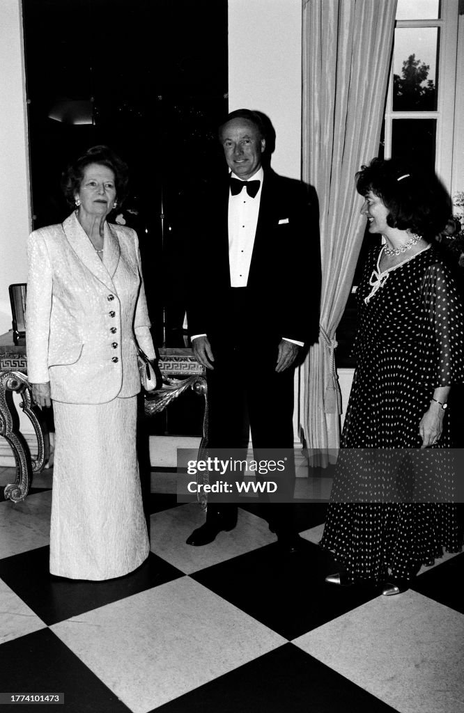 Margaret Thatcher, Robin Renwick, and Annie Renwick attend a party at ...