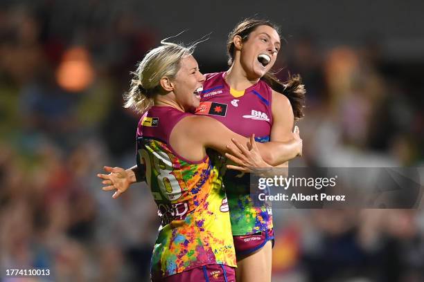 Charlotte Mullins of the Lions celebrates with Ruby Svarc after kicking a goal during the round 10 AFLW match between Brisbane Lions and Melbourne...